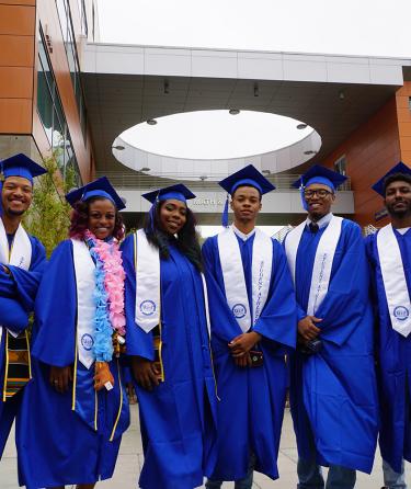 Black African American student athletes in cap and gown