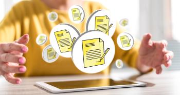Image of digital forms floating above tablet