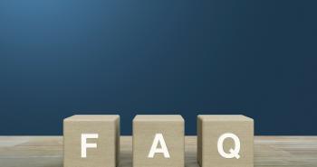Block of wooden tiles spelling FAQ