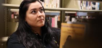 Student Looking at Books