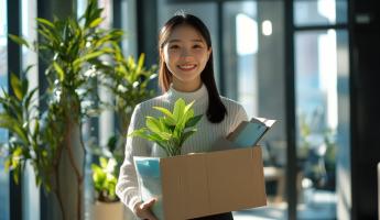 New employee carrying a box