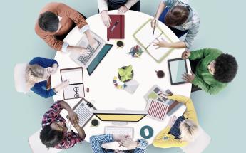 Diverse group working around a table