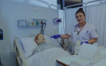 Female nursing student in patient simulation