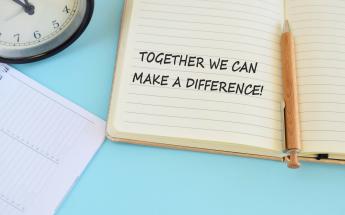 Together we can make a difference phrase on notebook