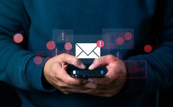 Person on cell phone receiving emergency information