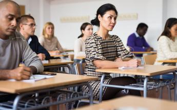 men and women in classroom at adult education class