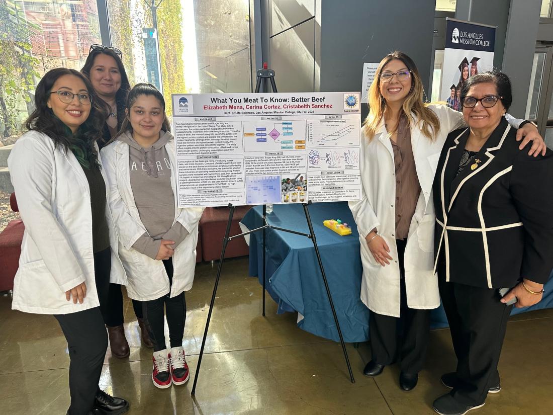 Biotech students presenting their research project with LAMC Dean Farisa Morales and faculty member Chander Arora