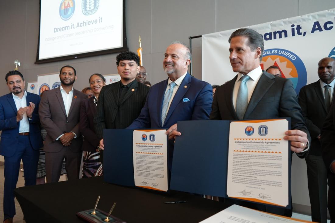 Chancellor Rodriguez and Superintendent Carvalho holding partnership agreement