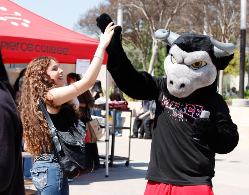 Clarence the Bull with a prospective student