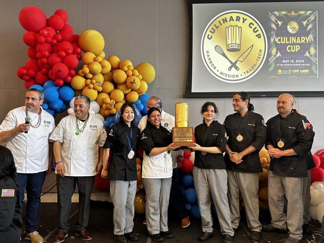 LAHC Culinary Arts students holding the golden chef trophy