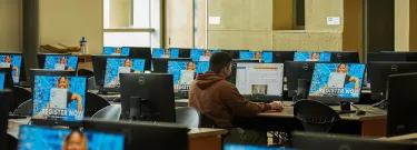 A student works in the library at San Bernardino Valley College in San Bernardino on May 30, 2023. Photo by Lauren Justice for CalMatters
