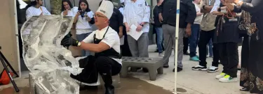 Los Angeles Trade-Tech College professor Martin Gilligan forms an ice sculpture during the Culinary Cup, an annual competition between the culinary arts programs of L.A. Mission College, L.A. Harbor College and L.A. Trade-Tech College. (Gustavo Arellano / Los Angeles Times)