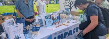 A Los Angeles Valley College student viewing the services available through The Impact-Foundation LA at a mental health resource fair held on their campus, May 12. (SFVS/el Sol Photo/Gabriel Arizon)