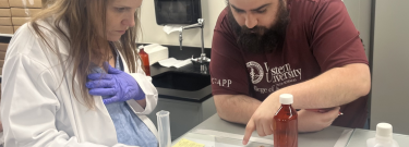 Joanne Scott, left, practices pharmaceutical compounding, part of Mt. San Antonio College's short-term vocational pharmaceutical technician program