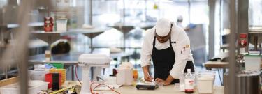 LATTC Culinary Art student in the kitchen