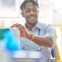 Doctor smiling and holding papers
